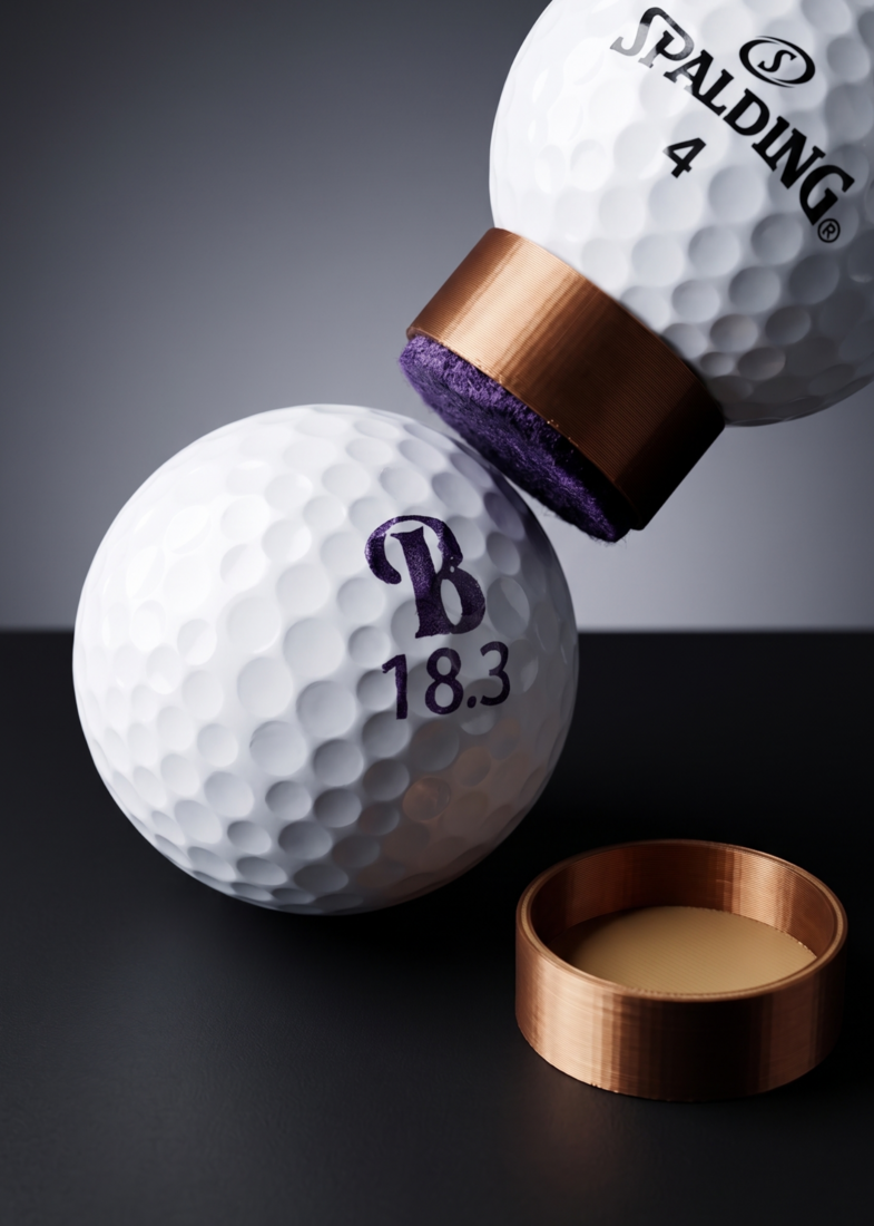 Golf ball stamped with a custom initials mark